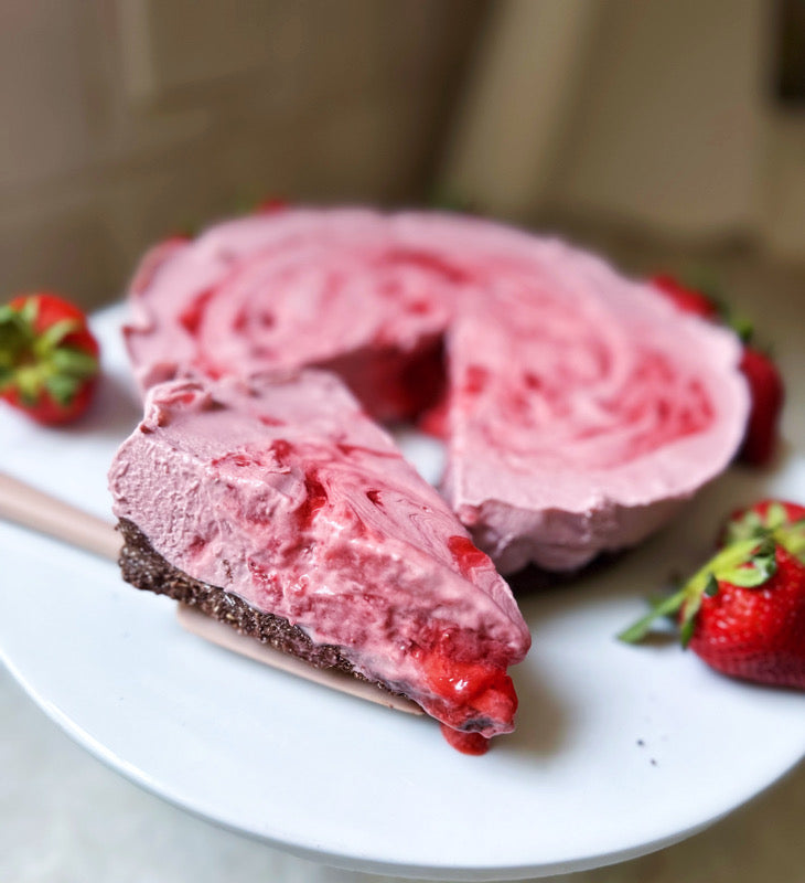 https://tastyasfit.com/cdn/shop/articles/Strawberry_Glaze_Swirl_Cheesecake_2_730x.jpg?v=1686595810
